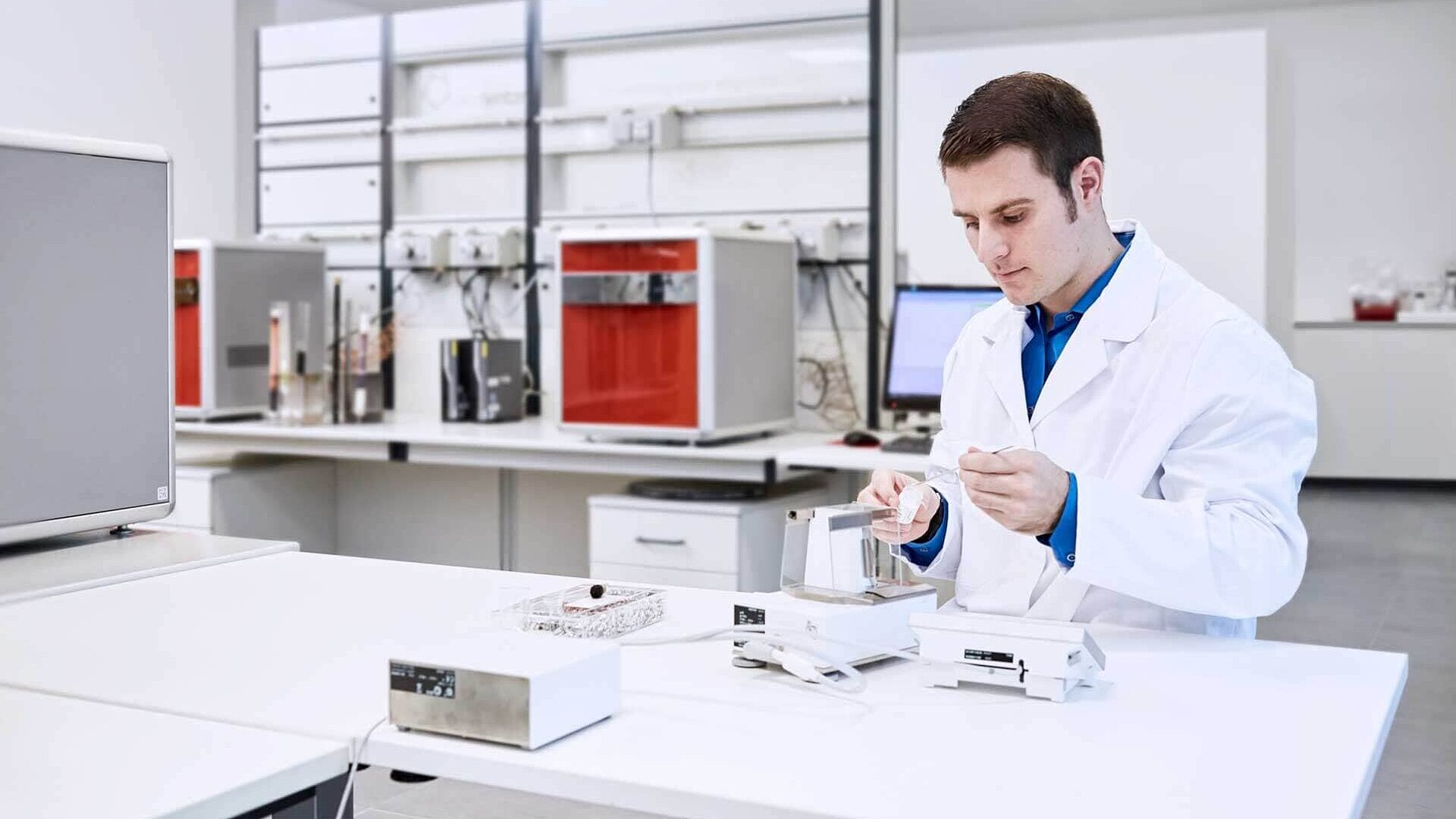 Laboratory technician weighing samples
