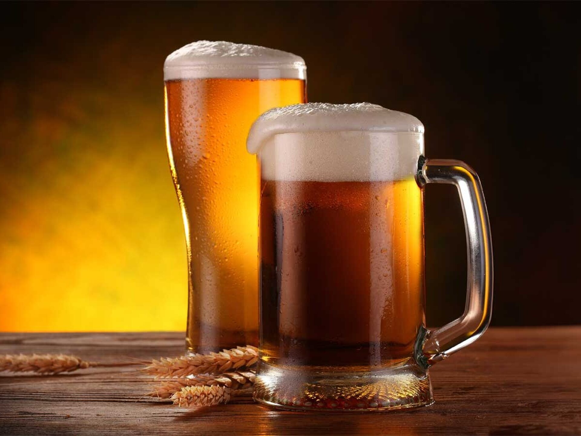 2 beer mugs with beer